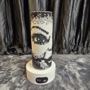 Artistic Beaded Vase with Eye Design